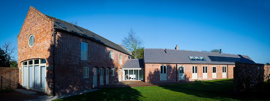 renovation from derelict farm building to a family home with staff blue sanded roof tiles to match old handmades
